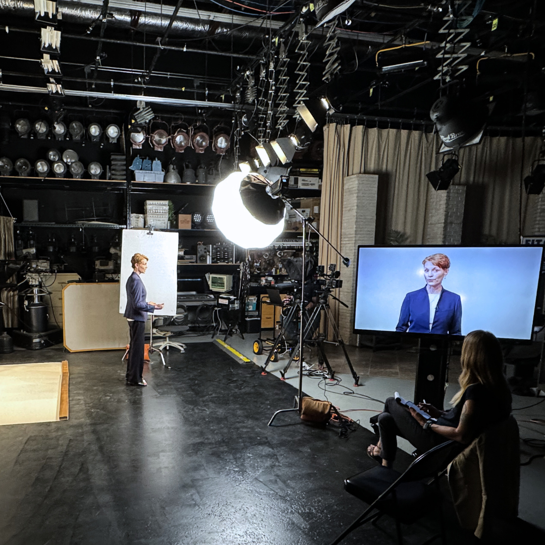 Reed Featured in PBS “Summer Reads” Series, shown in image is a photo of Dr. Reed talking to a camera at the East TN PBS studios.